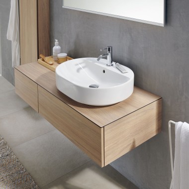 Lay-on washbasin with tap hole bench and deck-mounted tap on furniture in oak colour