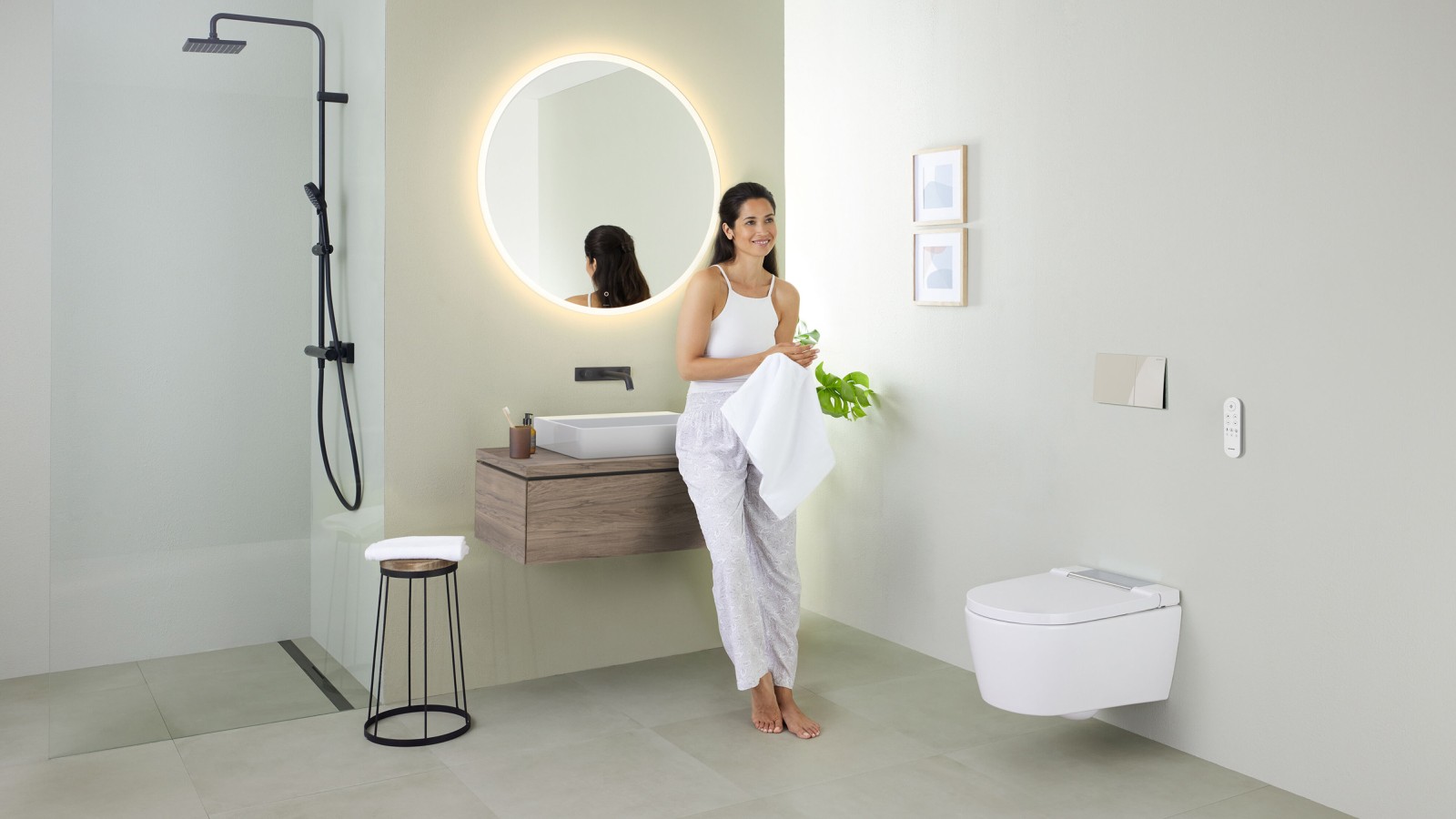 Woman in a bathroom with Geberit AquaClean Sela Woman in a bathroom with Geberit AquaClean Sela