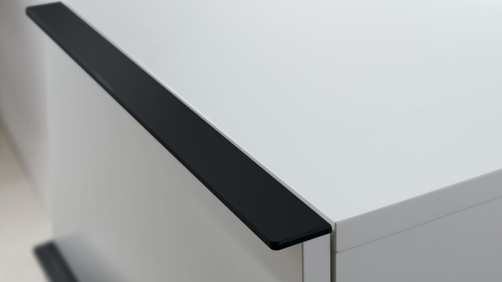 Geberit iCon side cabinet in white with black handles Geberit iCon side cabinet in white with black handles