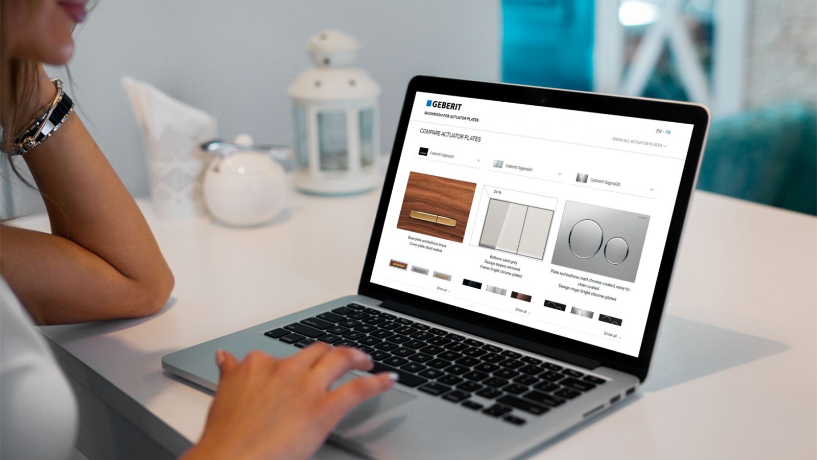 Woman launches the Geberit flush plate showroom on her laptop Woman launches the Geberit flush plate showroom on her laptop