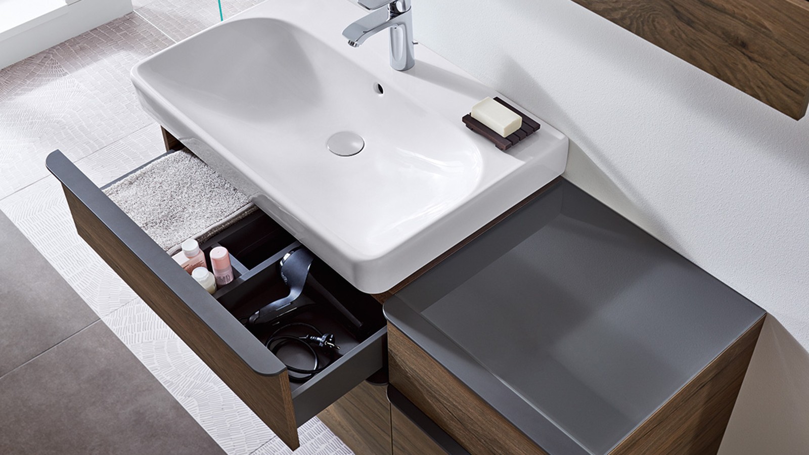 Geberit Smyle washbasin and furniture with opened drawer