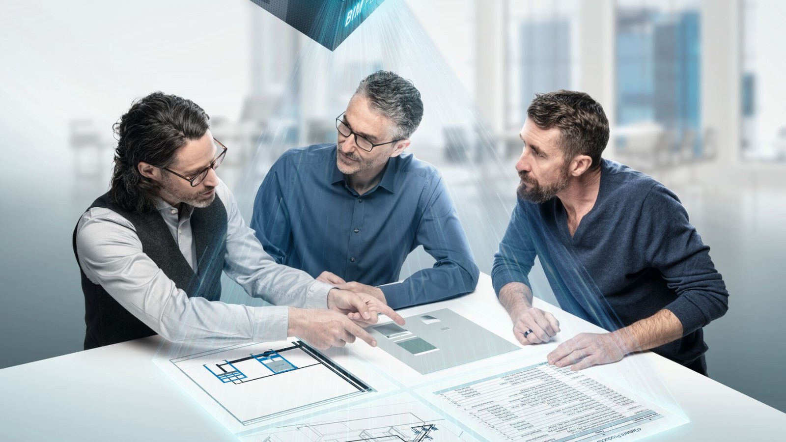 Des planificateurs en pleine discussion autour d'une table avec un symbole BIM Des planificateurs en pleine discussion autour d'une table avec un symbole BIM